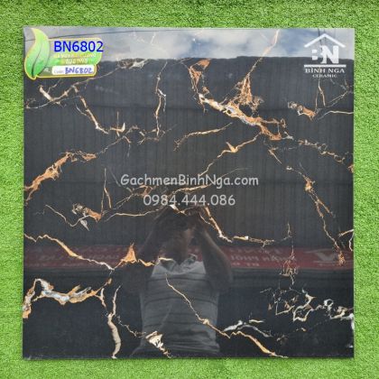 Mẫu gạch đen vân cam 60x60 men kim cương 
