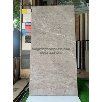 Gạch bóng kiếng 60x120 xám đậm, vân đá lát phòng khách Apodio 207THUY 